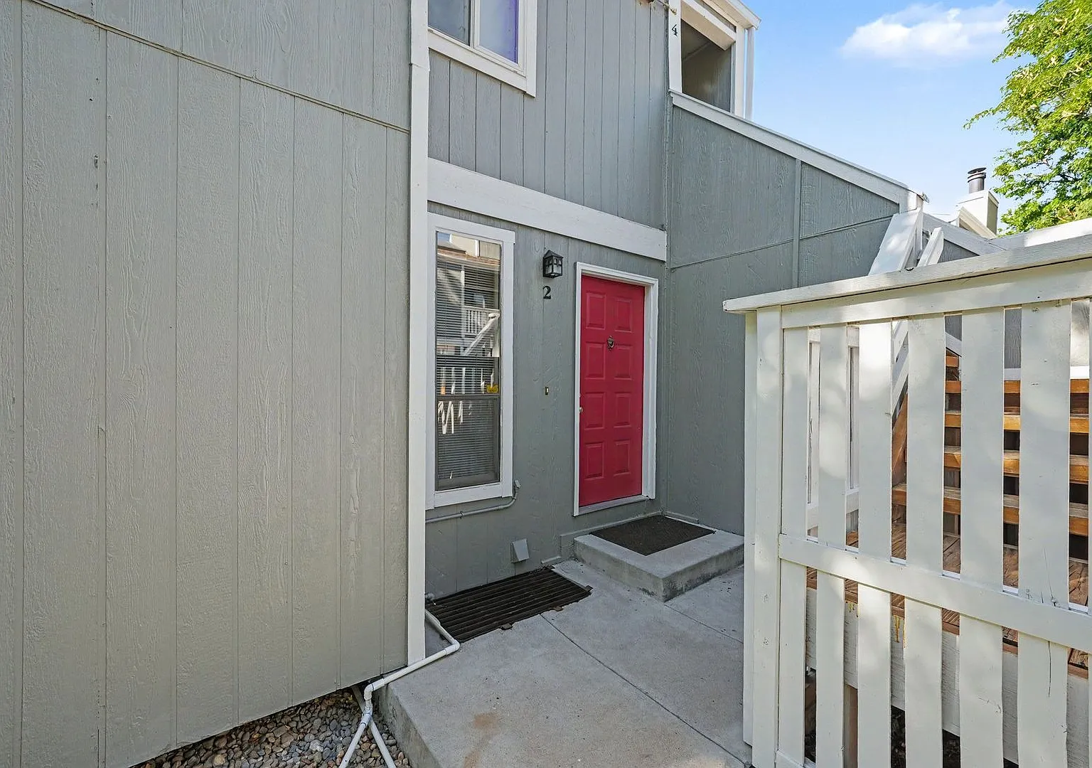 Spacious 2BR/2BA Corner Unit with Finished Basement, Private Patio & Garage — Photo 1