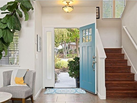 Entrance and stairs leading to 3 bedrooms and 2 bathrooms.