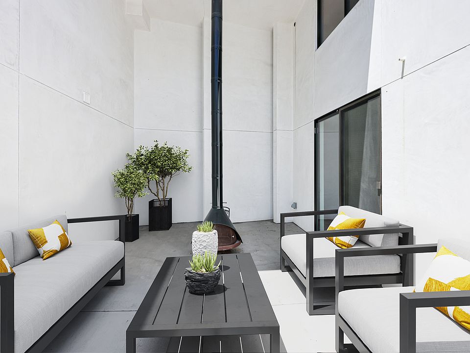 Private Enclosed Patio Featuring Fire Place