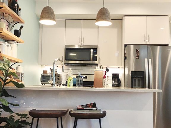 Modern Kitchen with granite, stainless steel appliances.