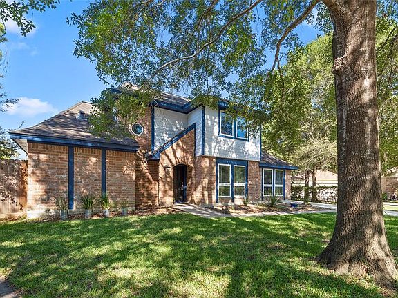 Mature shade trees shade the front yard