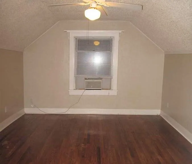 Upstairs south bedroom. House has central air & heat but this room has a supplemental window AC unit for extra cooling!