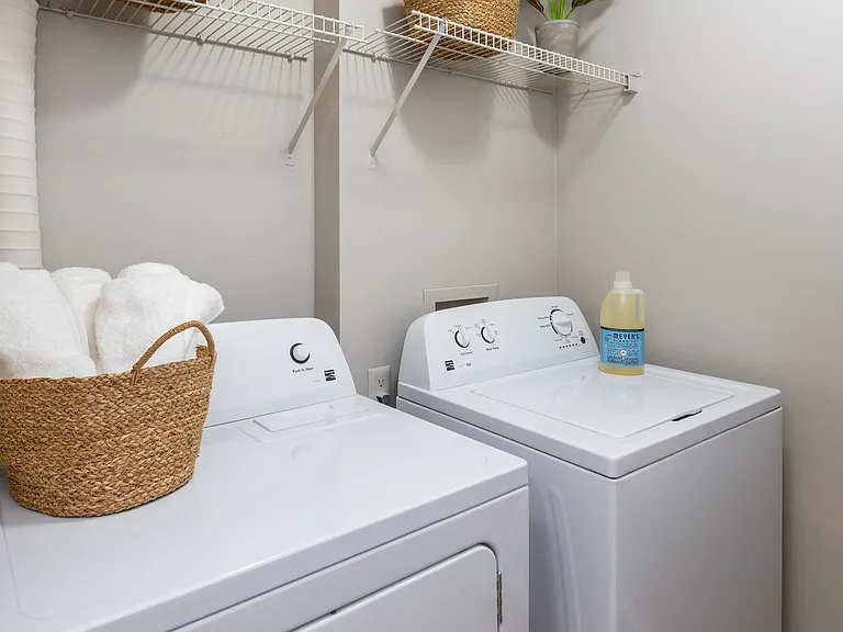 Enjoy the ease of doing laundry from the comfort of your own apartment with an in-unit washer and dryer, plus added shelving for storage.
