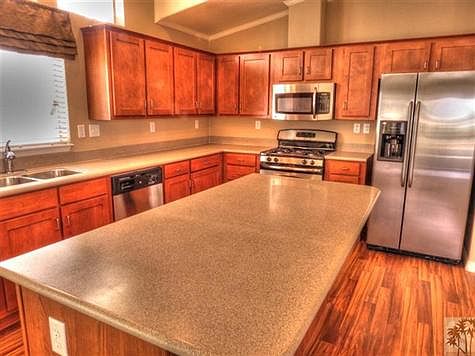 Up graded kitchen with stainless steel appliances.