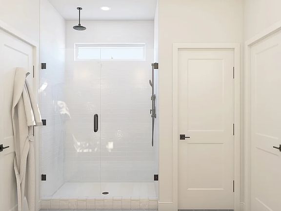 Primary bath with glass shower enclosure