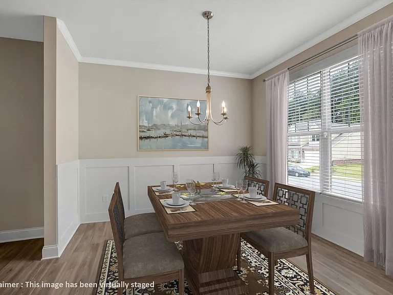 Elegant dining area bathed in natural light.