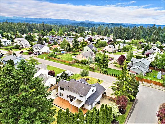 Overhead view showing off the huge deck on back of home with covered area and look toward the foothills that is often what we see on cloudy days.....