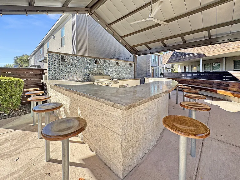 Enjoy outdoor grilling under on shaded grill area