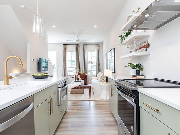 Representative photo - 2nd floor open concept kitchen, dining & living area with access to covered porch