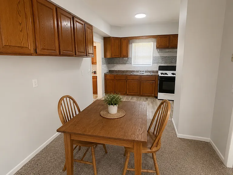 Dining room with extra storage cabinets Decor for staging purposes only. This is an unfurnished home
