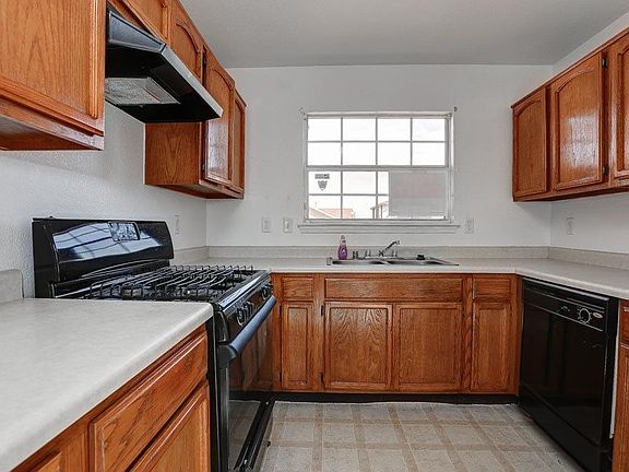 Kitchen also has plenty of cabinets and countertop space.