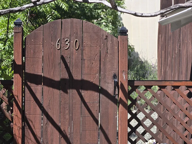 home is located behind 620 6th st
with all the pink roses in front.