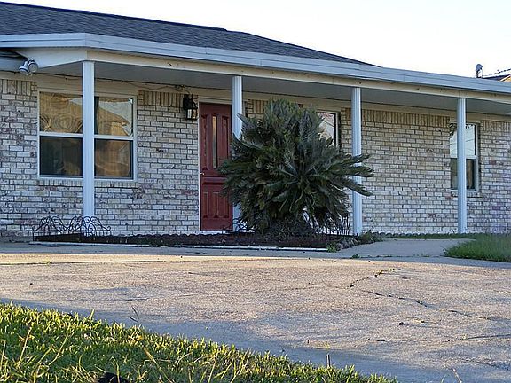 Front view of home.  Large covered porch greets you - your family and friends!