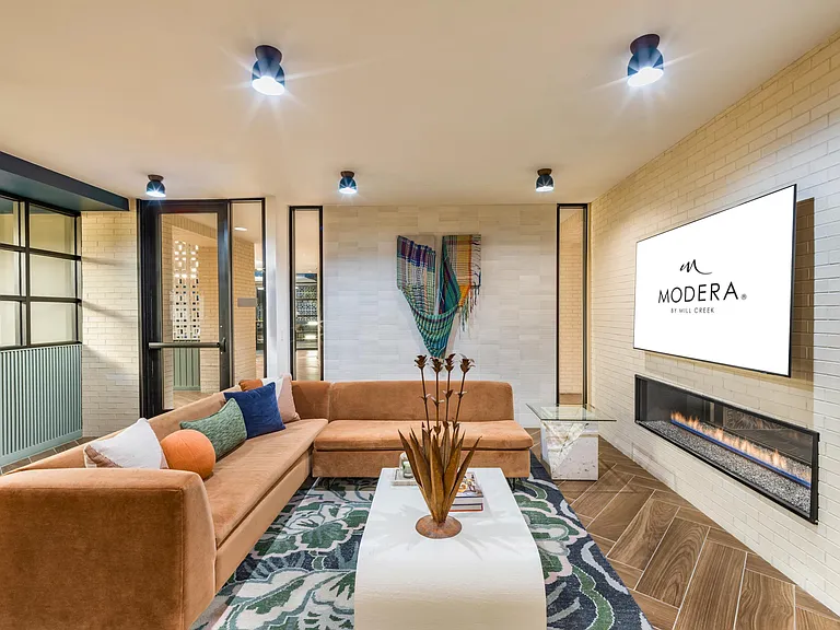 Unwind and catch your favorite shows at Modera EaDo's TV lounge, with comfortable seating for the ultimate relaxation experience.