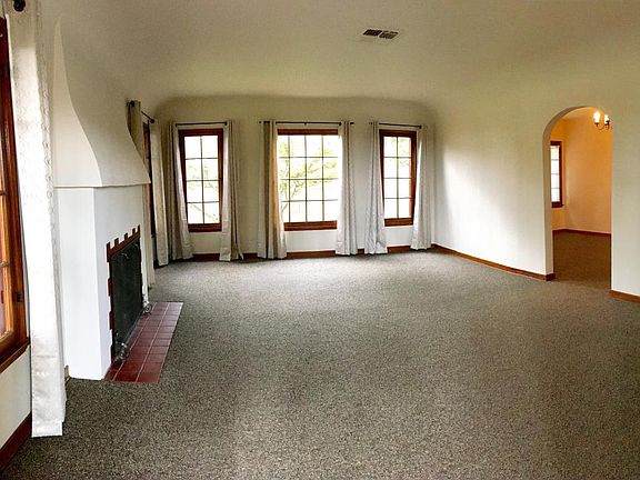 Large living room. Bright & airy with fireplace.