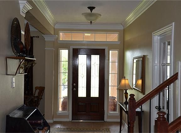 ...view of the foyer looking towards the front door; formal living / office / 5th bedroom to the right