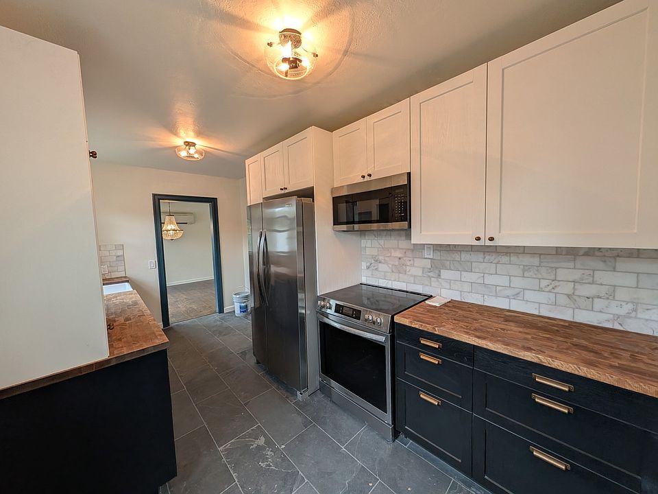 Another kitchen view showing marble backsplash.