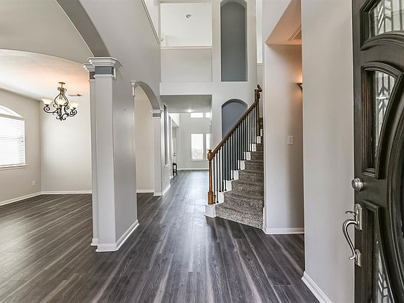Come on in! As you can see, the space is open and the height of the ceiling makes this space feel expansive. After looking at the photos and comments, please check out the Virtual Tour link. You can walk through the house just like you are in the hou