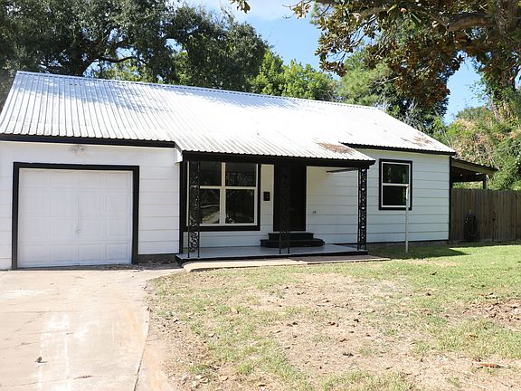 Beautiful curb appeal with updated exterior and fresh landscaping.
