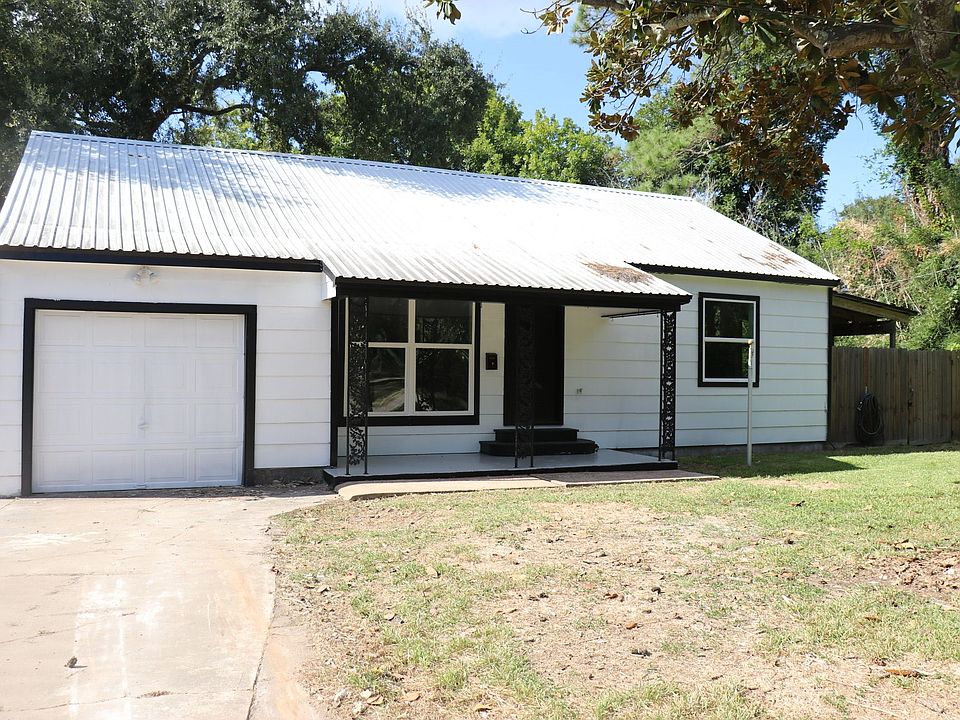 Beautiful curb appeal with updated exterior and fresh landscaping.