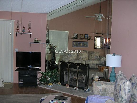 Living room with newer tile floors and gas fireplace