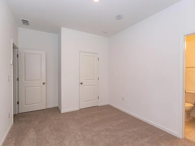 Another view of the spacious bedroom.