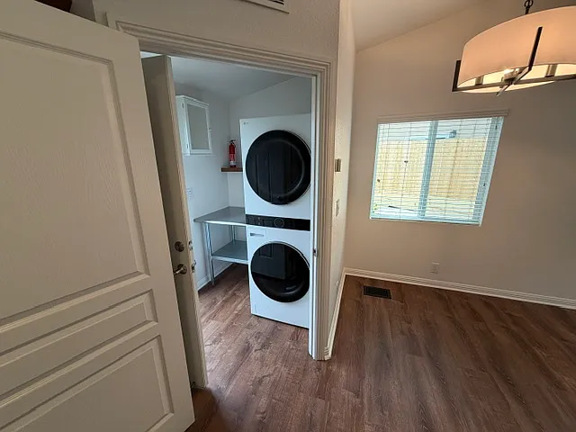 Full sized washer & dryer; door closes off laundry room