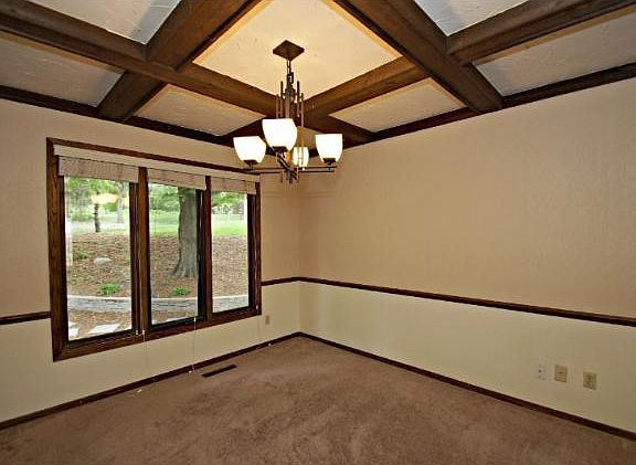 Gorgeous coffer ceiling add elegance to the formal dining room.