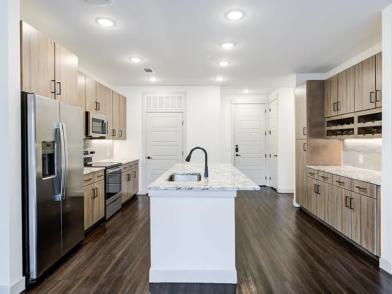 Open-Concept Kitchen With Built-In Wine Storage and Ample Cabinetry