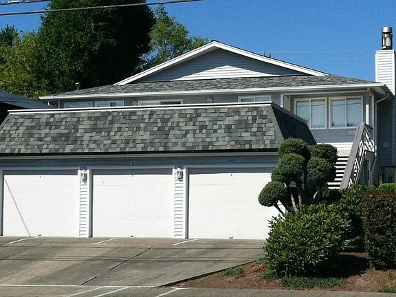 Triplex. One of the garages (left) is available, additional parking in front of this garage and free parking off street. The unit is on the second floor.