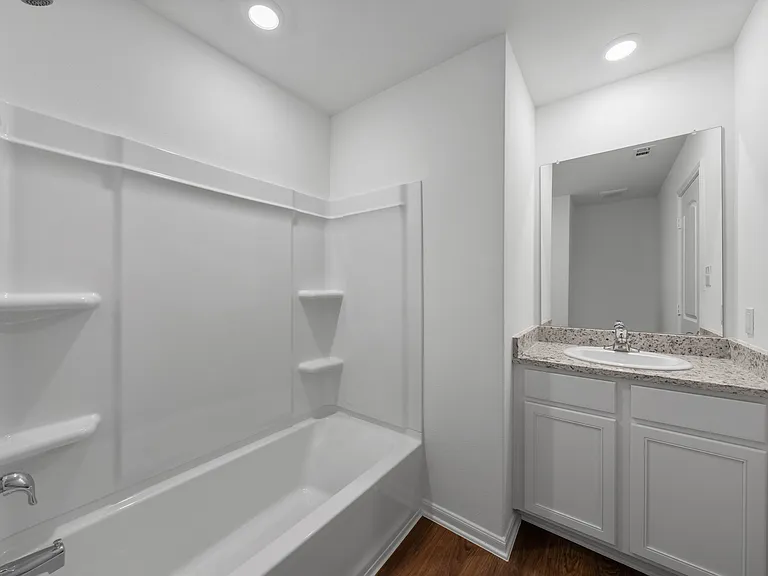 Second bathroom with a shower/tub combination.
