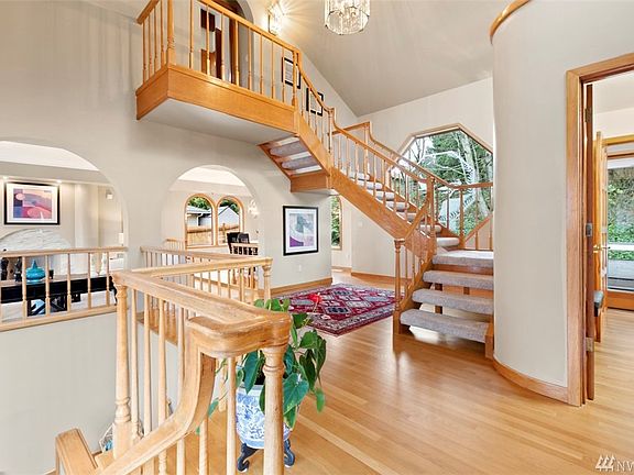 Gleaming Hardwood Floors, Wood-Wrapped Windows and Doors, Plus Rounded Entry Ways and Several Statement Windows and Skylights for an Abundance of Natural Light