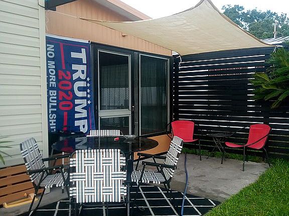 Retractable awning on water patio