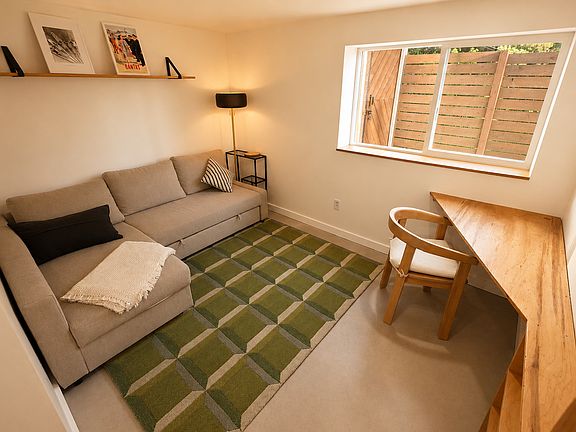 Bedroom #2, located downstairs. Couch converts to queen size bed. Will include all bedding & foam mattress toper for added comfort.