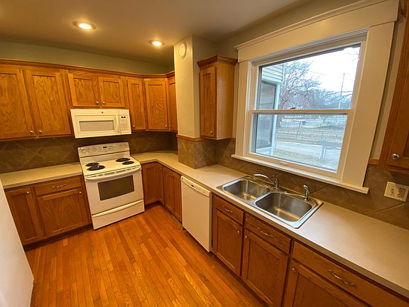 Bright, shiny kitchen complete with appliances.