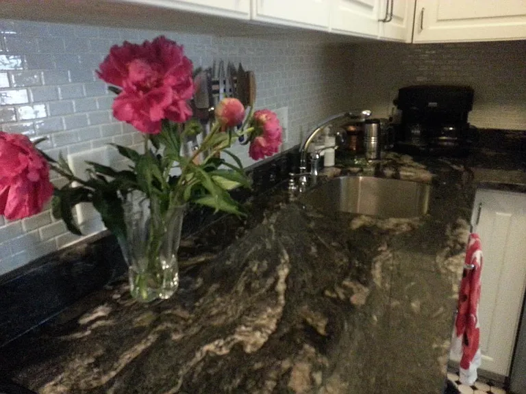 granite countertops and subway tile backsplash