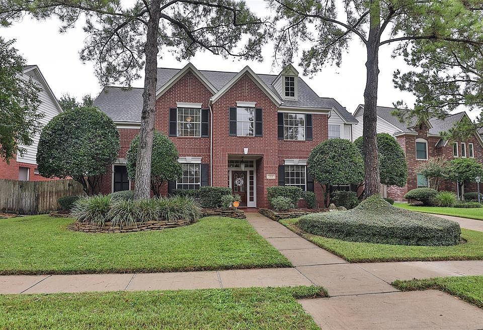 Welcome to this classic Village Builders two-story in the heart of the master planned community of Copperfield Westcreek. The traditional red brick exterior and mature landscaping provide an inviting curb appeal
