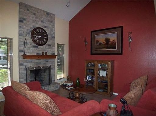 Cozy Living Room with Floor to Ceiling Fireplace.