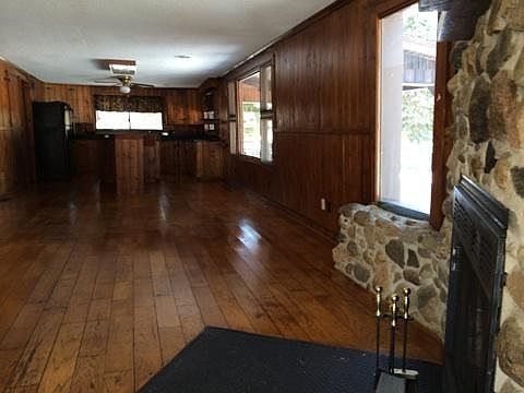spotless hardwood floors and knotty pine walls
