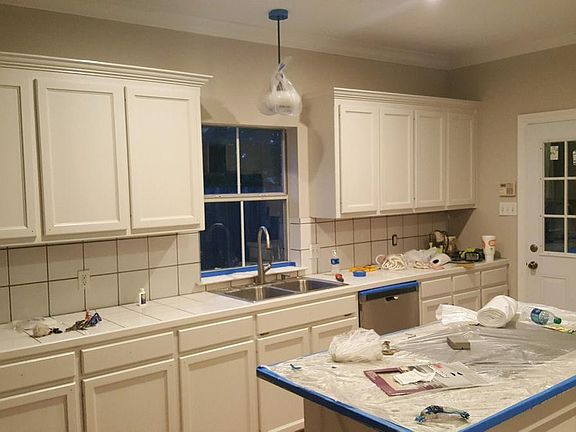 Kitchen during renovation - slab granite island
