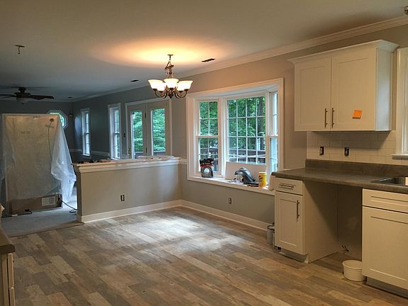 Eating area with large bay window is open to the family room.