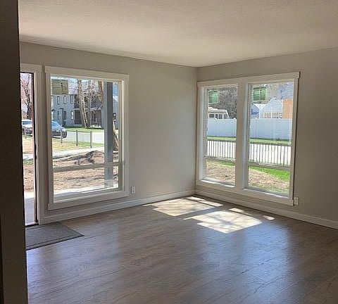 Lower unit with easy access. No stairs into unit. Lots of light with large new windows. New trendy hard surface floors.