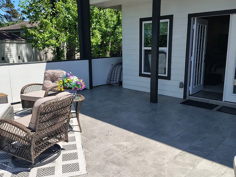Huge outdoor deck off of 2nd story living area great for family gatherings and parties. Covered patio on the first floor.