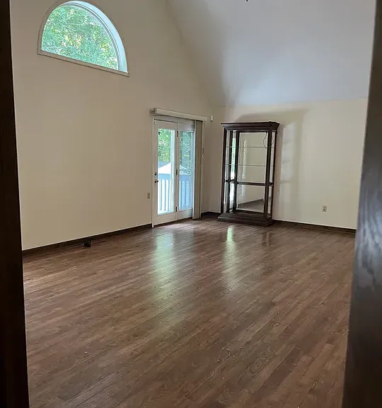 Living room with 2 doors to the deck