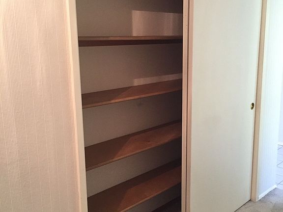 Large hall closet, opposite side has a coat closet