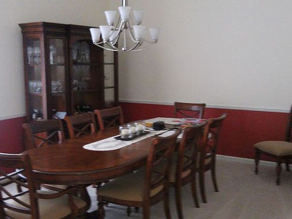 Looking to the left from the entryway is this formal dining room.