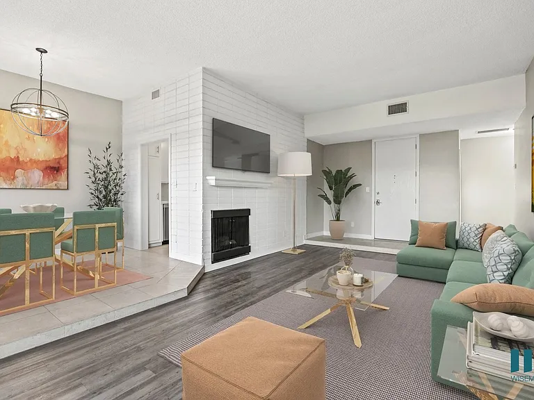 Open-Concept Dining and Living Room Area with Electric Fireplace