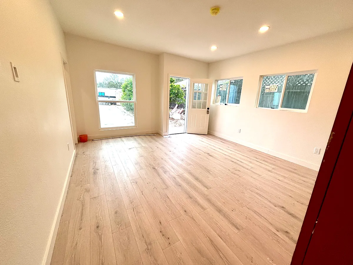 Spacious Living Room, recessed lighting, great natural light. - 4535 Hollister Ave #101