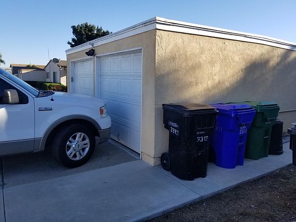 Garage on right, comes with lock; trash Ian shared with fron