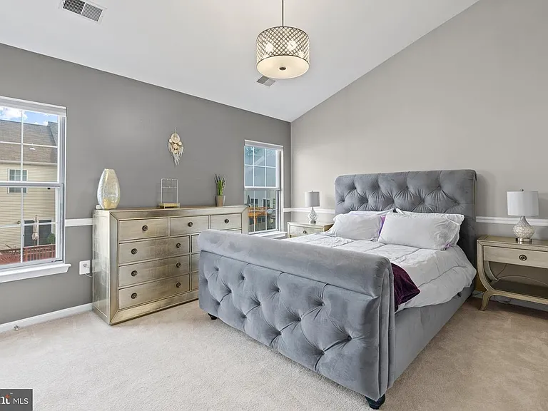 Primary with an ensuite bathroom and a walk-in closet